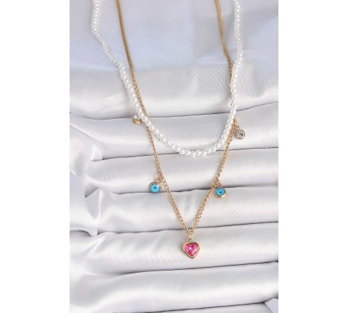 316L Çelik Gold Renk 2'Li İnci Zincir Model Pembe Taşlı Kalp Figür Nazar Boncuk Detay Kadın Kolye - TJ-BKO10112 316L Çelik Gold Renk 2'Li İnci Zincir Model Pembe Taşlı Kalp Figür Nazar Boncuk Detay Kadın Kolye - TJ-BKO10112